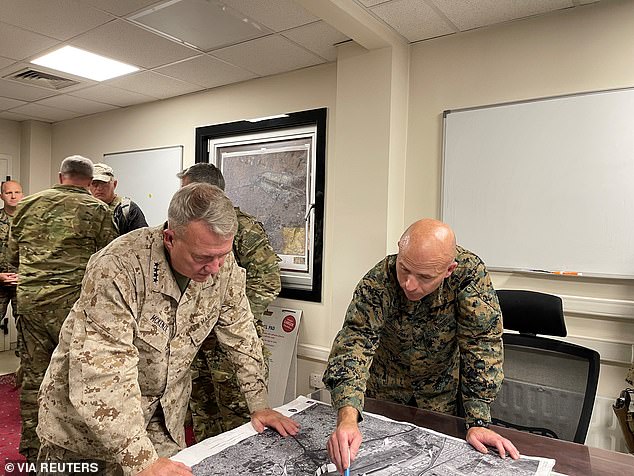 Retired General Frank McKenzie (L) planned the US military withdrawal from Afghanistan just days before the last US troops left the country