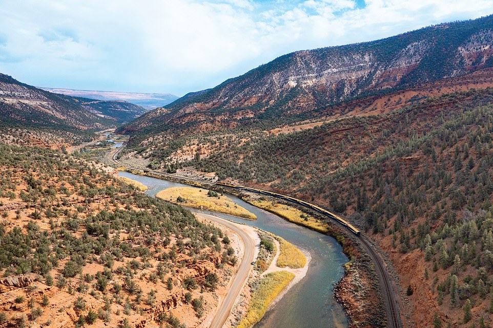 “As you ascend from desert prairies you quickly wind between jagged, snow-capped peaks and through vast, red-colored canyons,” writes Tom