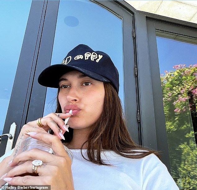 Hailey Baldwin Bieber donned her 'Happy' hat and showed off her $500,000 wedding ring in a new photo, which she Instagrammed to her 51.1 million inmates on Wednesday amid divorce rumors