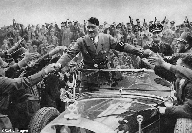 Hitler is cheered by an adoring crowd after being appointed chancellor in 1933