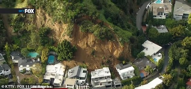 Three homes in Hollywood Hills, California were damaged by a landslide (pictured) after heavy rainfall caused significant ground movement