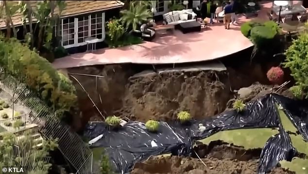 Several homes in Newport Beach, California were given a yellow tag by officials after a landslide hit the cliff behind the properties