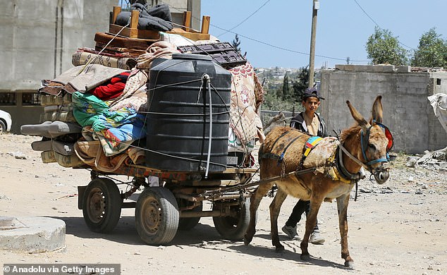 Some Palestinians return to their homes after Israeli forces withdraw from the Nuseirat refugee camp in Deir al-Balah, Gaza, on April 21, 2024