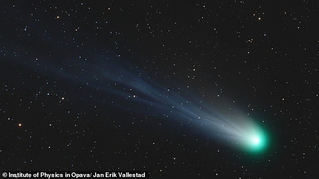 The dazzling green 'devil's comet' (pictured) could be visible to the naked eye over Britain tonight