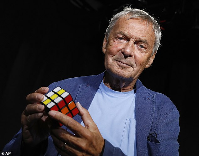 Gamemaster: Erno Rubik with one of his classic cube puzzles