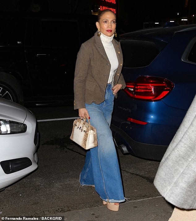 Jennifer Lopez looked stunning in a casual chic ensemble as she stepped out for dinner with a friend in New York on Saturday