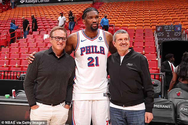 Miami Dolphins CEO and F1 Miami Managing Partner Tom Garfinkel, NBA star Joel Embiid and Miami GP Ambassador Guenther Steiner (left-right) pose after the game