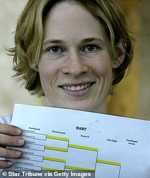 Kari Bailey of Minneapolis holds up an NCAA women's basketball tournament that she entered into the office pool in 2004