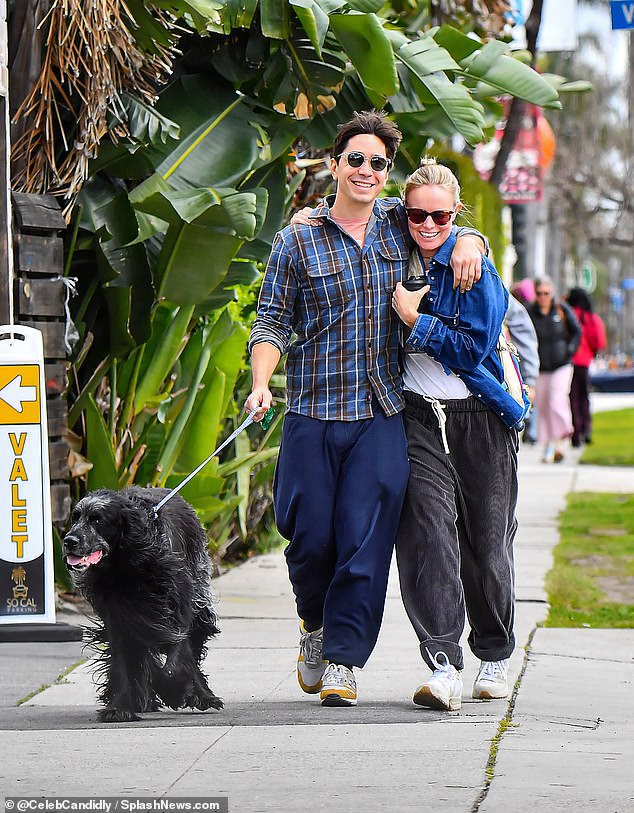 Kate Bosworth and her husband Justin Long couldn't keep their hands off each other as they packed on the PDA as they left Erewhon on Wednesday afternoon