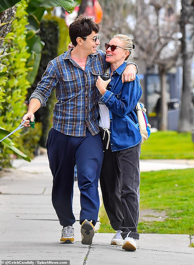 For their laid-back date, the actor, 45, wore a blue and brown flannel over an orange T-shirt, navy sweatpants and sneakers