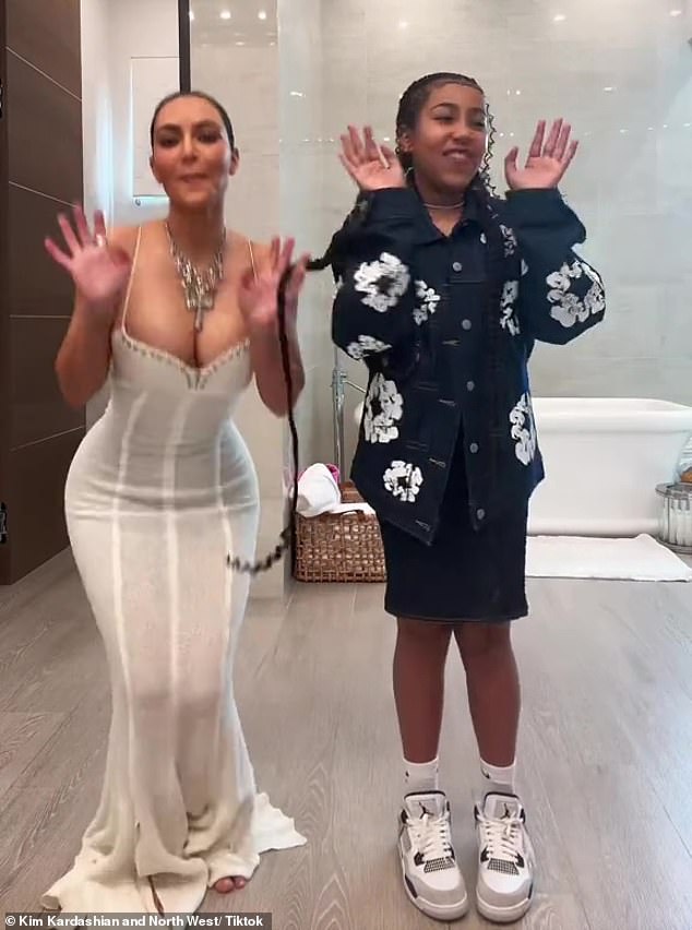 The 43-year-old mogul - whose mother Kris Jenner, 68, hosted a party - modeled a sexy white dress with a low-cut studded neckline in a short TikTok video