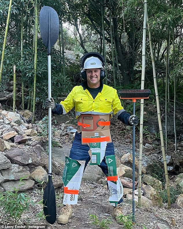 According to the caption he posted with the images, his wife Sylvie drew his attention to the snake in their backyard.  In the next photo, Larry was dressed in makeshift protective gear covering his legs, groin and stomach, made from old boxes.  Pictured: Larry Emdur