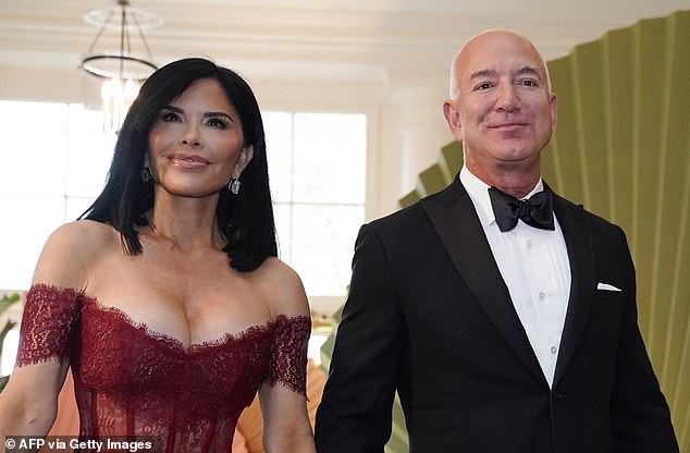 The 54-year-old wore a red Rasario off-the-shoulder lace and satin dress with a corset that retails for $2,200 for the event