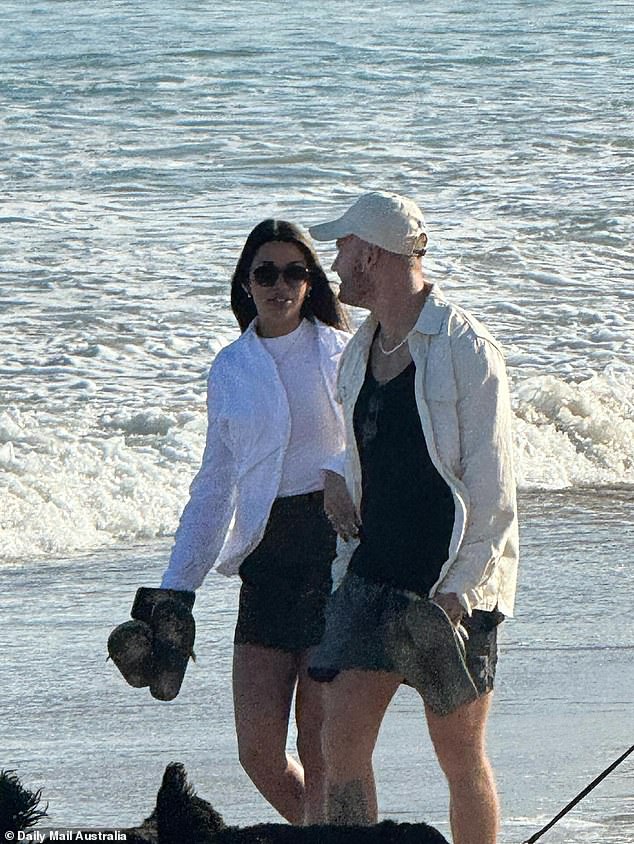 Married At First Sight groom Tim Calwell is anything but heartbroken following his split from TV bride Sara Mesa.  The 31-year-old Gold Coast entrepreneur was spotted taking a romantic beach walk with his new Brazilian girlfriend Barbara on a Gold Coast beach this weekend.