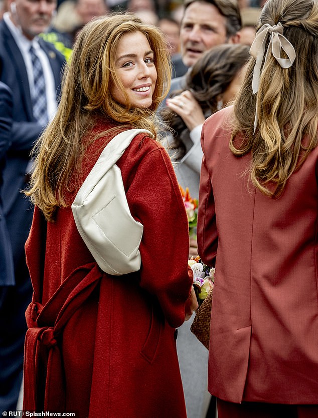 Princess Alexia of the Netherlands was elegant in a cream and orange ensemble as she attended the country's King's Day celebrations with her family today