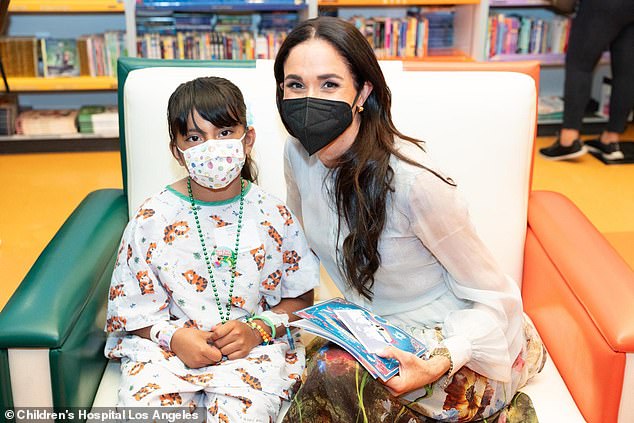 Meghan Markle handed out signed Polaroids to children during her visit to a Los Angeles children's hospital, new photos reveal