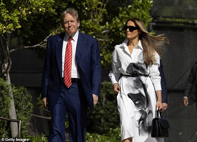 Former President Donald Trump and former first lady Melania Trump prepare to vote at a polling station in Palm Beach, Florida, on March 19