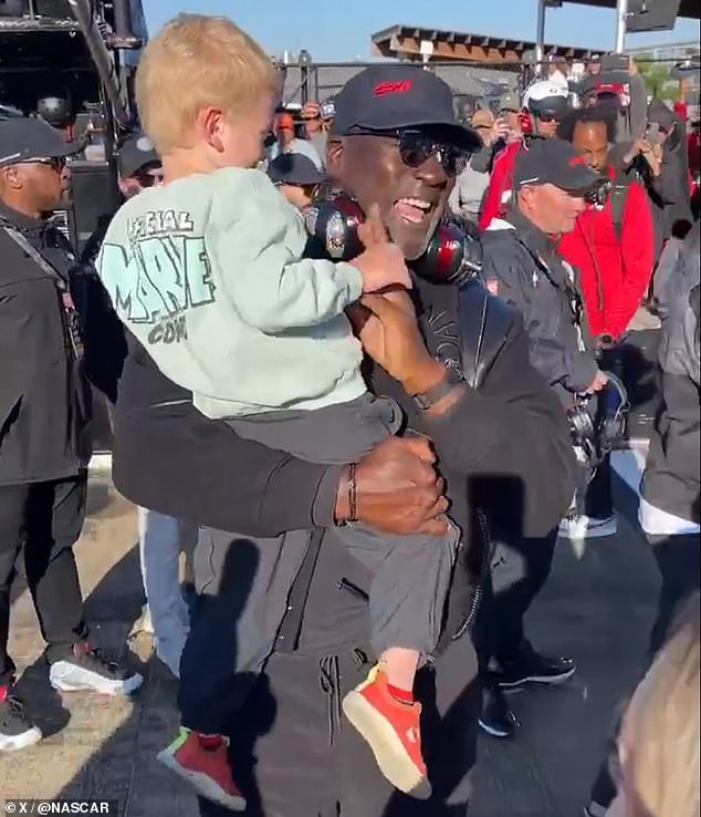 Michael Jordan celebrated 23XI Racing's victory at Talladega on Sunday with the son of his winning driver