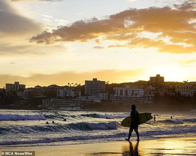 Australians in NSW, Victoria, ACT, South Australia and Tasmania get an extra hour of sleep before morning (Bondi photo at sunrise)