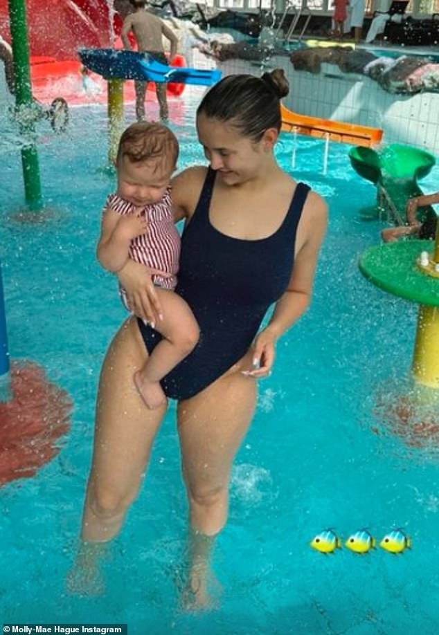 Molly-Mae Haag showed off her figure in a black swimsuit as she doted on her daughter Bambi during a family weekend getaway