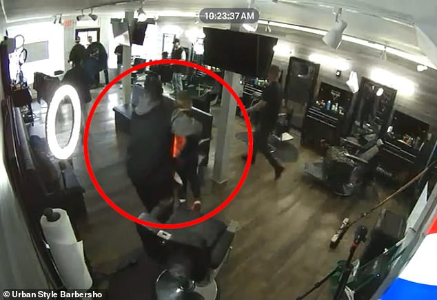 A New Jersey hairdresser was caught on camera carrying a child to safety and picking him up right in his arms.