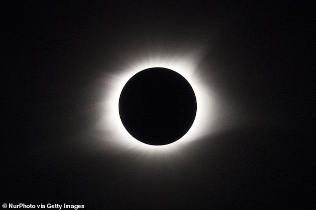 The solar eclipse (pictured) will spread 185 miles from Maine to Texas on Monday, but astronomers say the path of totality has shifted by 2,000 feet