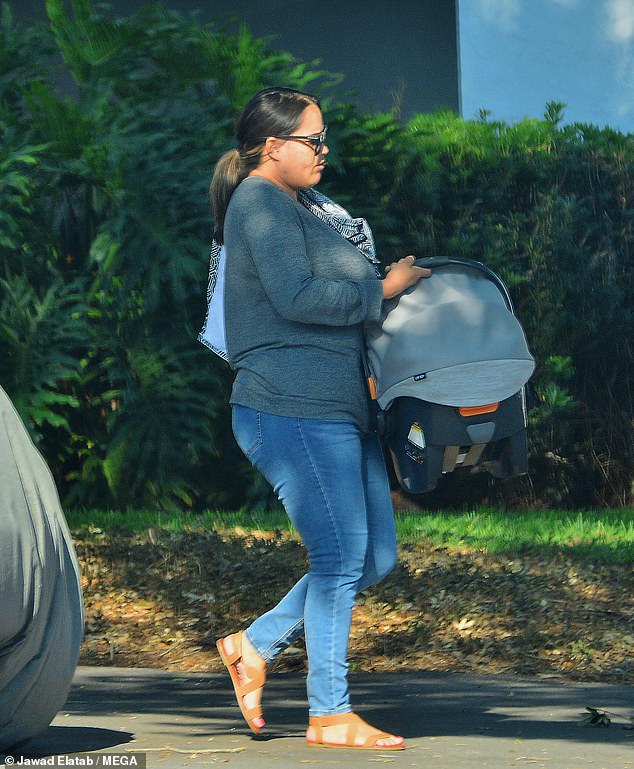 DailyMail.com spotted Sydney Simpson looking glum as she carried a car seat for her outside her apartment in St. Petersburg, Florida