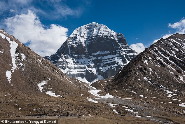 Mount Kailash (pictured), also known as Kangringboqe Peak, is one of the world's most sacred mountains - a peak that remains unclimbed