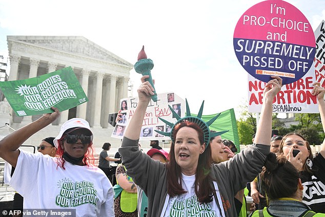 Pro-abortion rights protesters gathered outside the Supreme Court on Wednesday ahead of debate over whether Idaho's abortion ban violates federal EMTALA