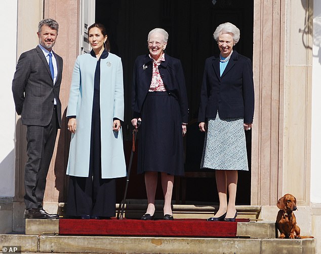 Queen Mary and King Frederik, Queen Margrethe and her sister, Princess Benedkeek, posed outside Fredensborg Castle today next to Margrethe's beloved sausage dog Tilia