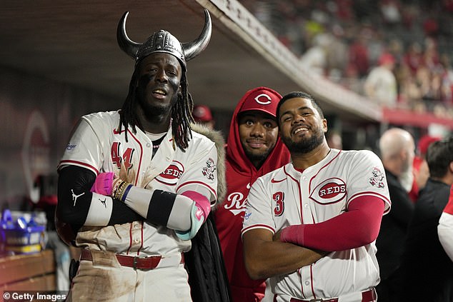 Elly De La Cruz (left) poses for a photo with Hunter Greene (center) and Jeimer Candelario