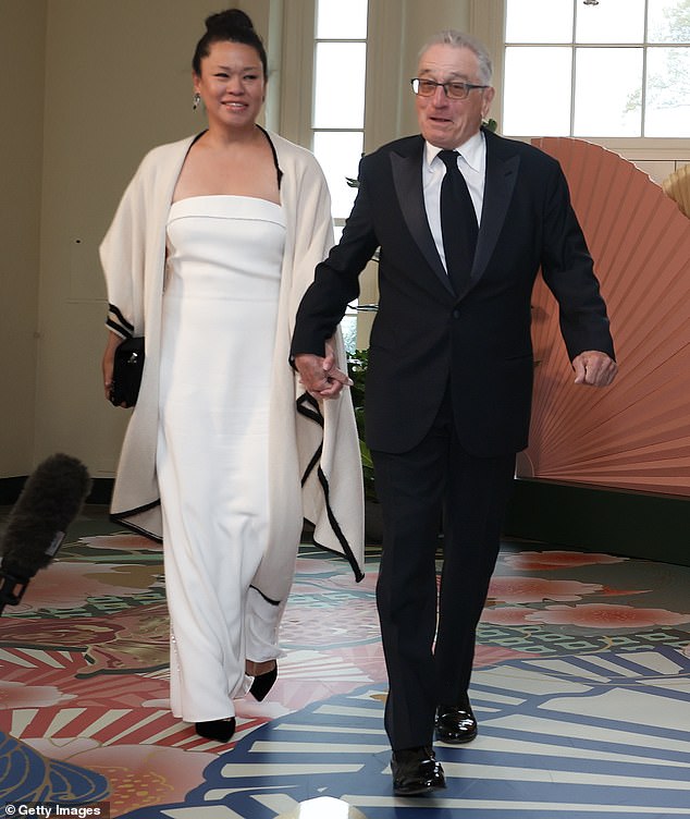 Robert, a typically understated star, dressed for the occasion in a black tuxedo with a white shirt, black tie and black patent leather shoes