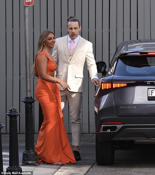 Jayden and Eden were all smiles as they stepped out of their car together, with Eden wearing a bright orange, figure-hugging dress and Jayden wearing a cream suit.  Both shown