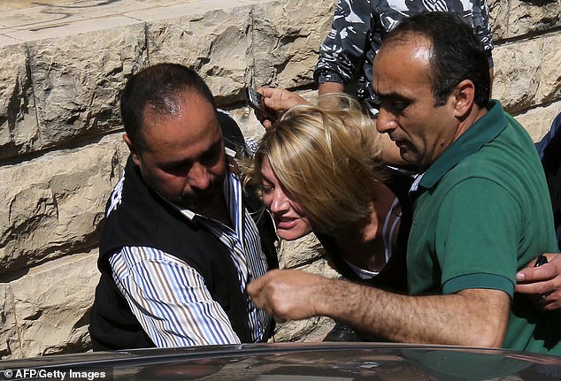 Staff are said to believe that if Channel Nine's 60 Minutes can overcome the infamous 'Beirut scandal', Seven's Spotlight can survive this scandal (Photo: 60 Minutes presenter Tara Brown being escorted from a Lebanese courthouse to Baabda prison in 2016 )