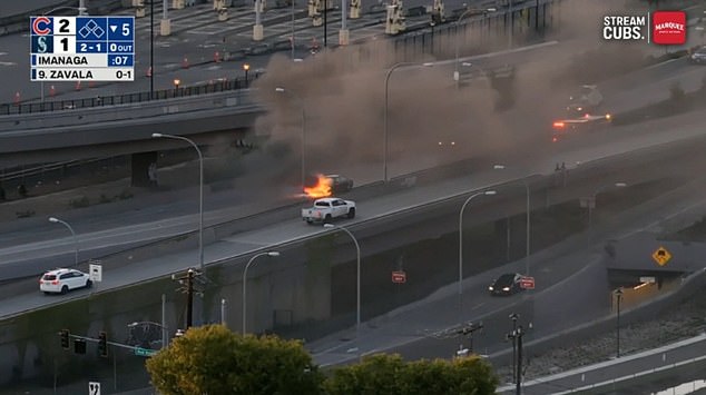 A car that burst into flames next to the Seattle Mariners' T-Mobile Park created a smoky fog