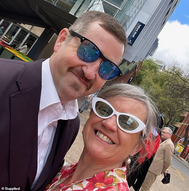 Stuart Brand died of a suspected self-inflicted gunshot in Adelaide's Outer Harbor shortly before 6pm on Monday, amid reports that members of the public witnessed the gruesome scene (pictured with his wife)