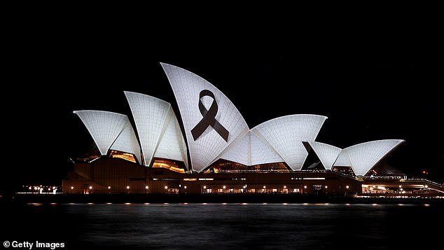 A black ribbon was projected onto the Sydney Opera House on Monday evening, two days after six people were killed in the deadly Bondi Junction massacre (pictured)