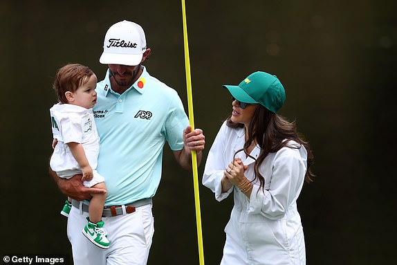 AUGUSTA, GEORGIA - APRIL 10: Max Homa of the United States with his wife Lacey and son Cam during the Par Three Contest prior to the 2024 Masters Tournament at Augusta National Golf Club on April 10, 2024 in Augusta, Georgia.  (Photo by Maddie Meyer/Getty Images)