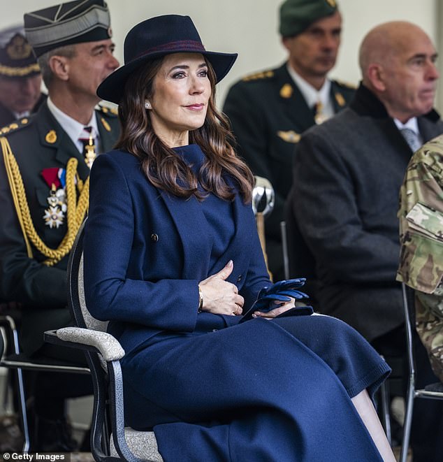 Fans love Queen Mary of Denmark's 'playful' manicures.  At an event, she styled her nails with a neutral color and sparkling gold flecks