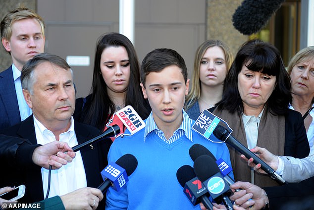 Thomas Kelly's brother Stuart (pictured centre) made a heartbreaking statement outside court