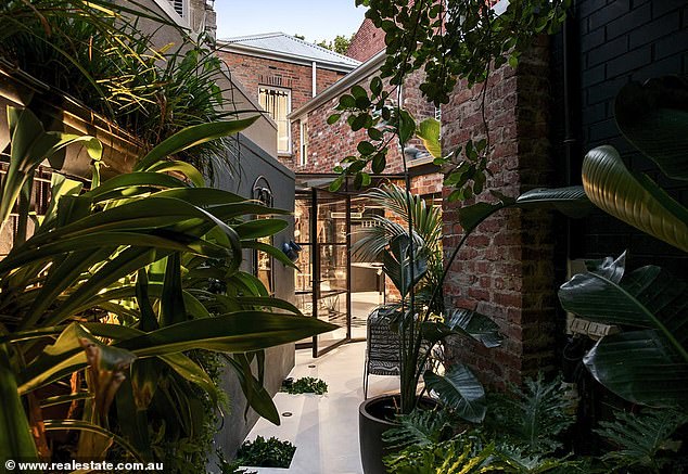 A dazzling inner-city Melbourne pad that was once home to pop star Tina Arena is going under the hammer.  Located just 3km from the CBD, the two-storey, three-bedroom, two-bathroom terrace is listed with a price guide of $2.95 million - $3.2 million.  (Pictured)