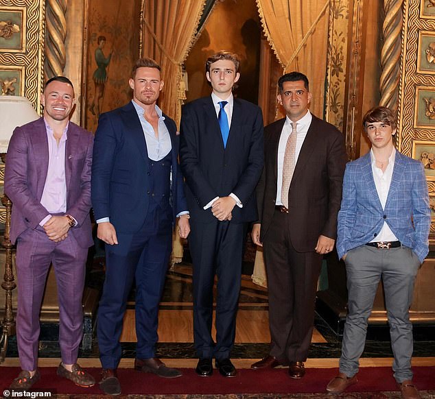 Barron Trump is his father's doppelgänger in a new photo of the 6'7" teen towering over guests (L-R) Colby Covington, Justin Waller, Patrick Bet-David and Bo Loudon