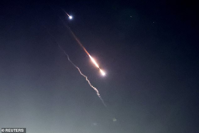 Objects are seen in the skies over Jerusalem after Iran launched drones and missiles towards Israel