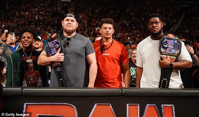 Patrick Mahomes with Chiefs teammates Creed Humphrey and Trey Smit during WWE Raw, Monday