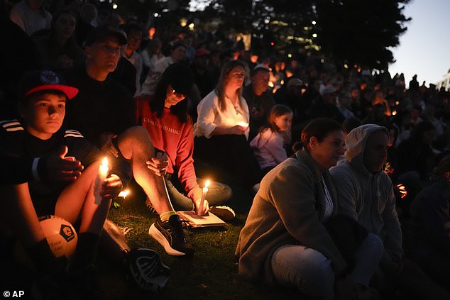 Mourners at Sunday's candlelight vigil took a minute's silence to remember the six innocent lives lost in the Westfield massacre