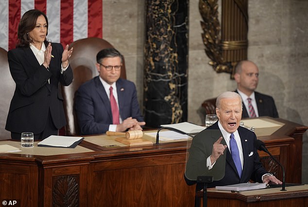 Speaker Mike Johnson sits stoically behind President Joe Biden during the annual State of the Union address as Vice President Kamala Harris applauds.  Johnson gained viral notoriety later that evening for rolling his eyes as Biden addressed the nation