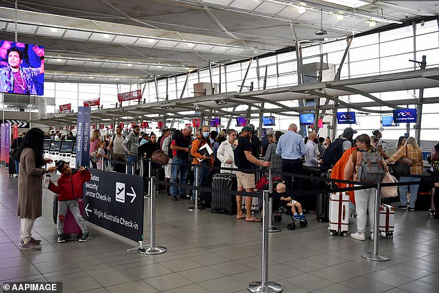 More than 100 flights to and from Sydney's domestic and international airports were canceled on Friday due to the extreme weather.  The photo shows a busy check-in at Sydney Airport