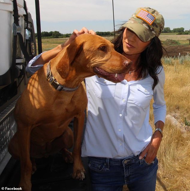 South Dakota Governor Kristi Noem is photographed with another dog she owned, Hazel, a Vizsla