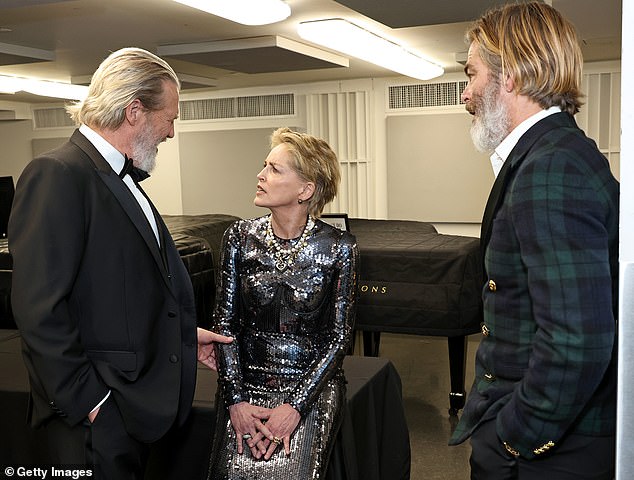 His current gray beard and semi-slicked back hair appear to resemble Jeff Bridges, whom he honored Monday at the 49th Chaplin Award Gala;  Sharon Stone is seen in the center