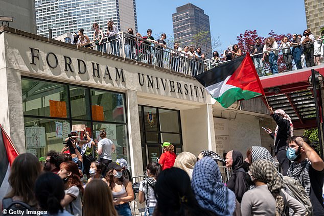 Ro-Palestinian protesters gather outside Fordham's Lincoln Center campus after a group created an encampment in the building on May 1, 2024 in New York City